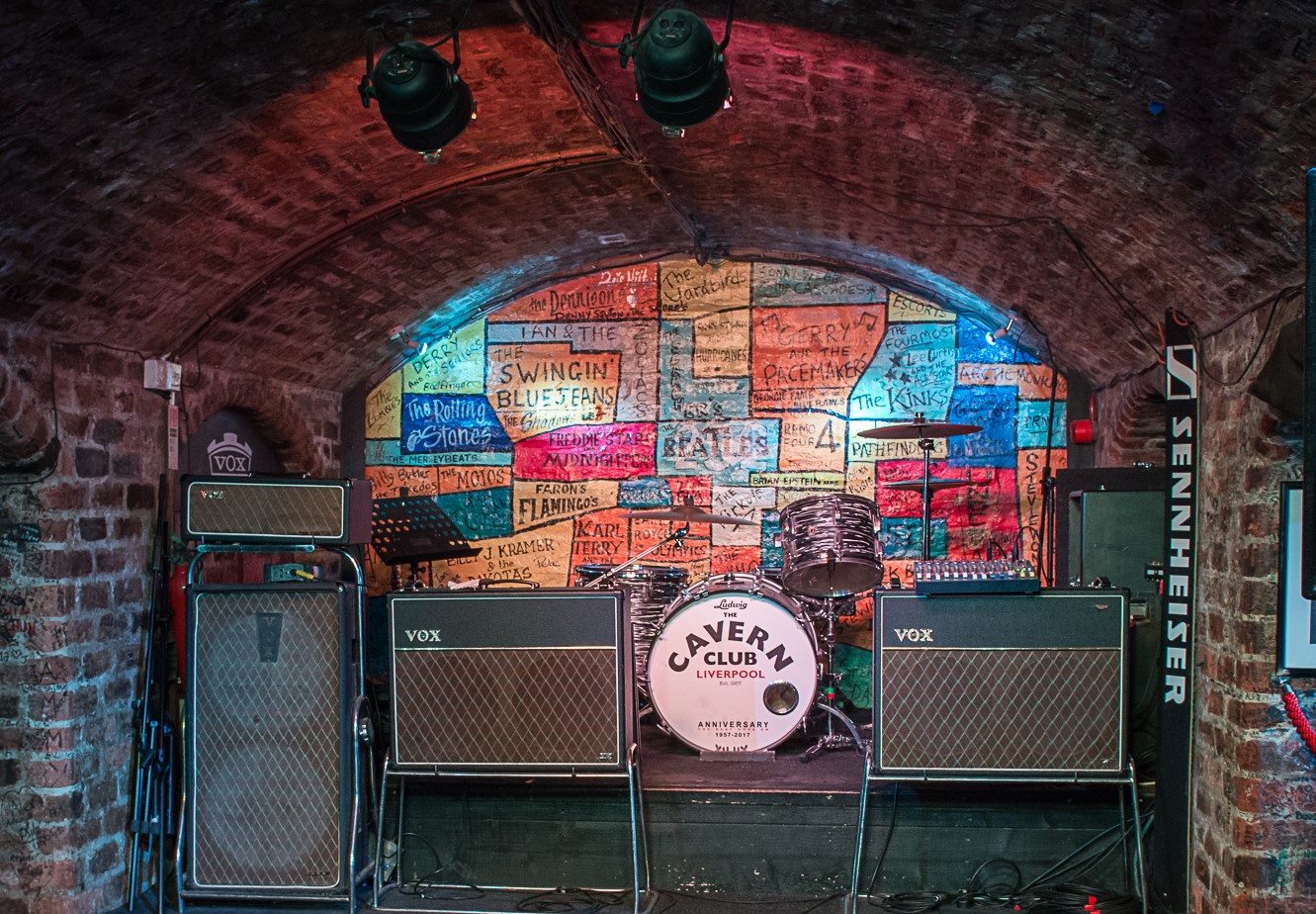 Inside Liverpool's famous Cavern Club.  A drum kit and autograph wall.
